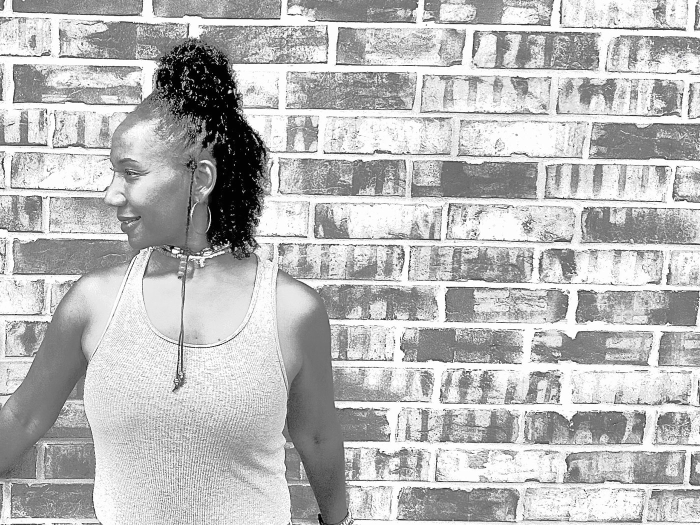 Nakara beside the brick wall